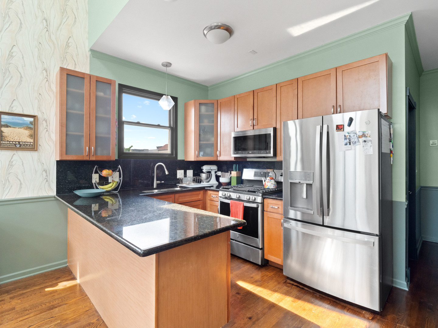 838 North Greenview Avenue, Unit 3 Chicago, IL 60642 - Photo 9 of 18 a kitchen with stainless steel appliances granite countertop a refrigerator stove microwave and sink