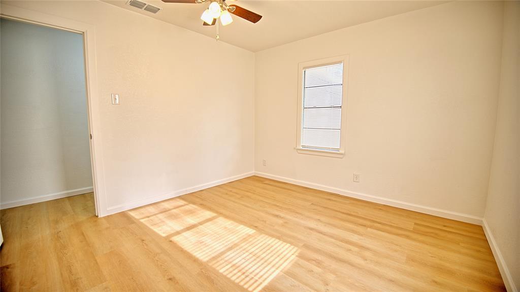 607 Baylor Street Nocona, TX 76255 - Photo 11 of 23 a view of an empty room and window