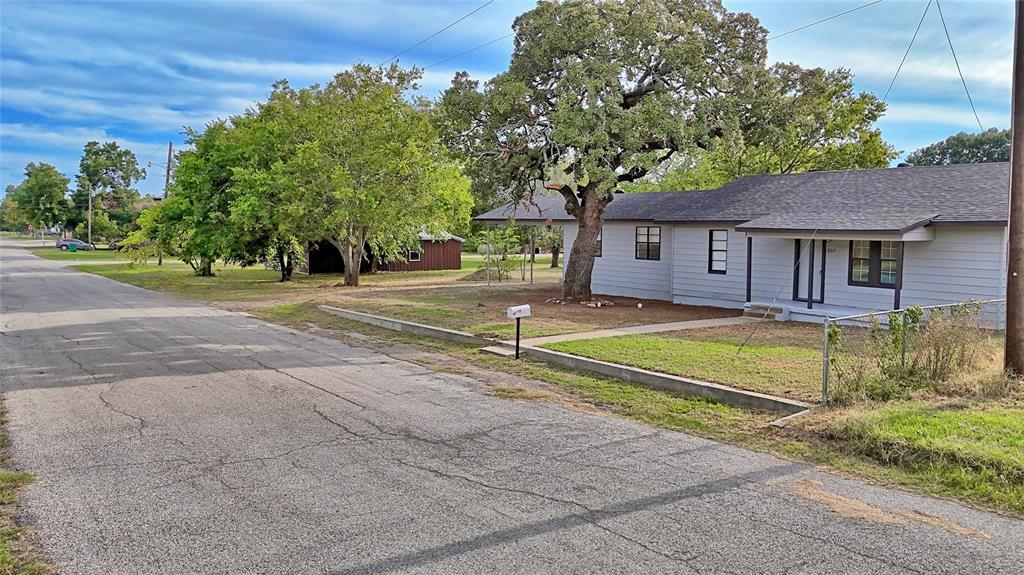 607 Baylor Street Nocona, TX 76255 - Photo 3 of 23 a view of house with outdoor space and shower