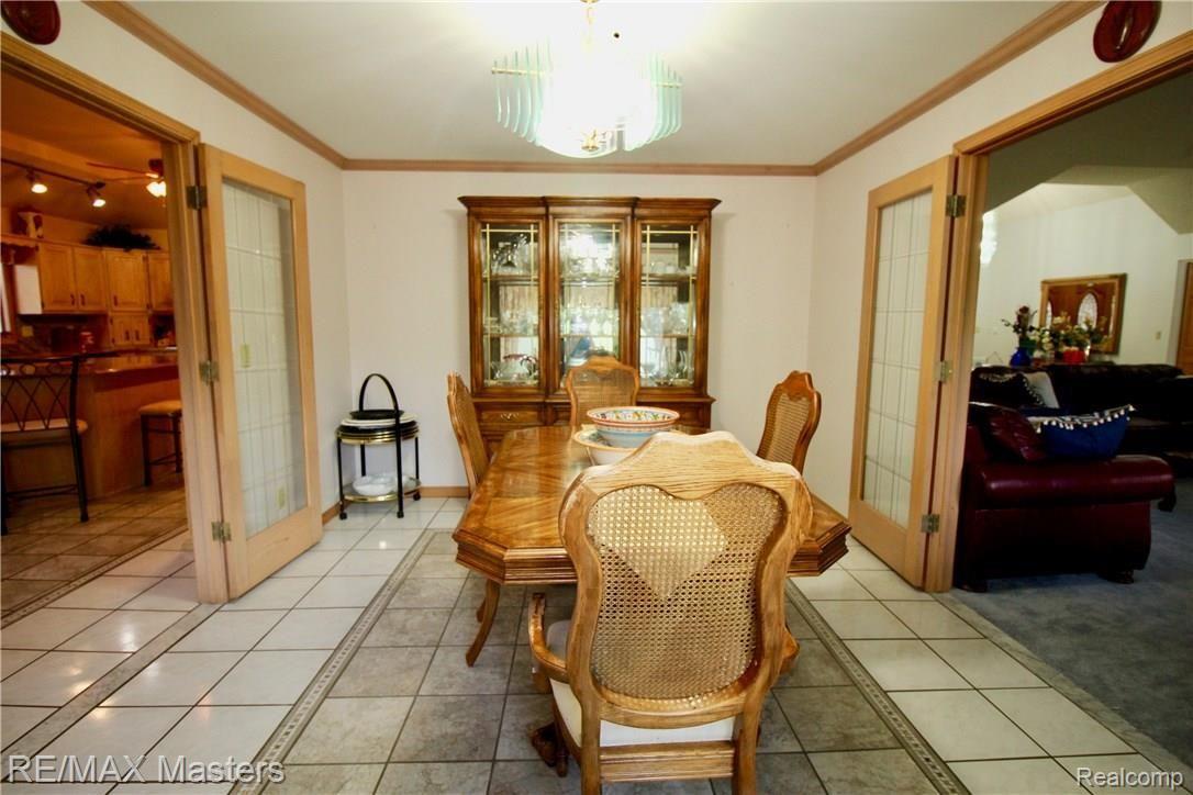 26454 Rinne Road New Boston, MI 48164 - Photo 9 of 41 Formal Dining Room has french doors from Great Room or Kitchen so whether its an overflow crowd, or just plain good dining, guests and family can easily find, sit and enjoy meal time together.