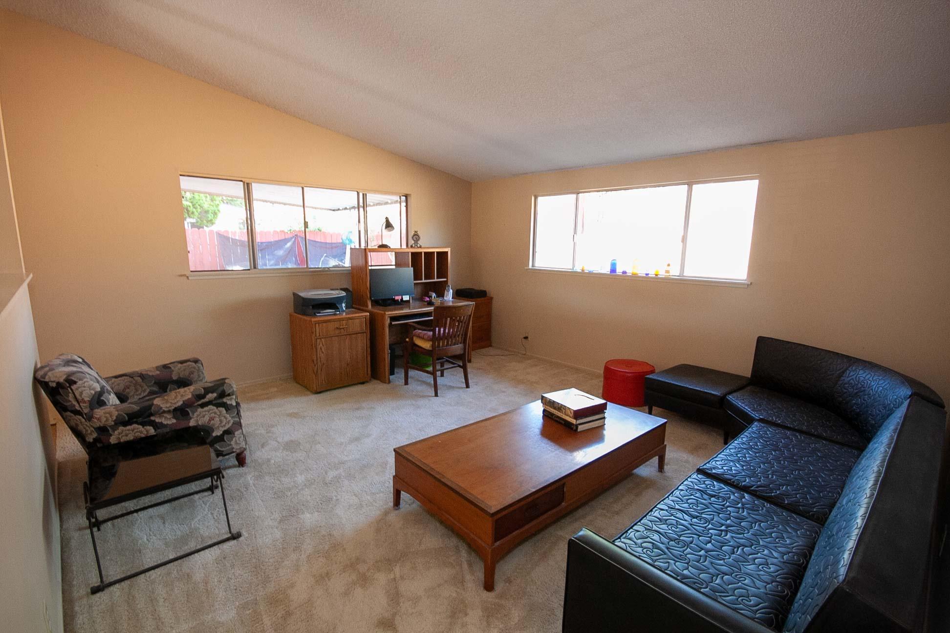648 Dara Road Goleta, CA 93117 - Photo 2 of 14 a living room with furniture rug and a window