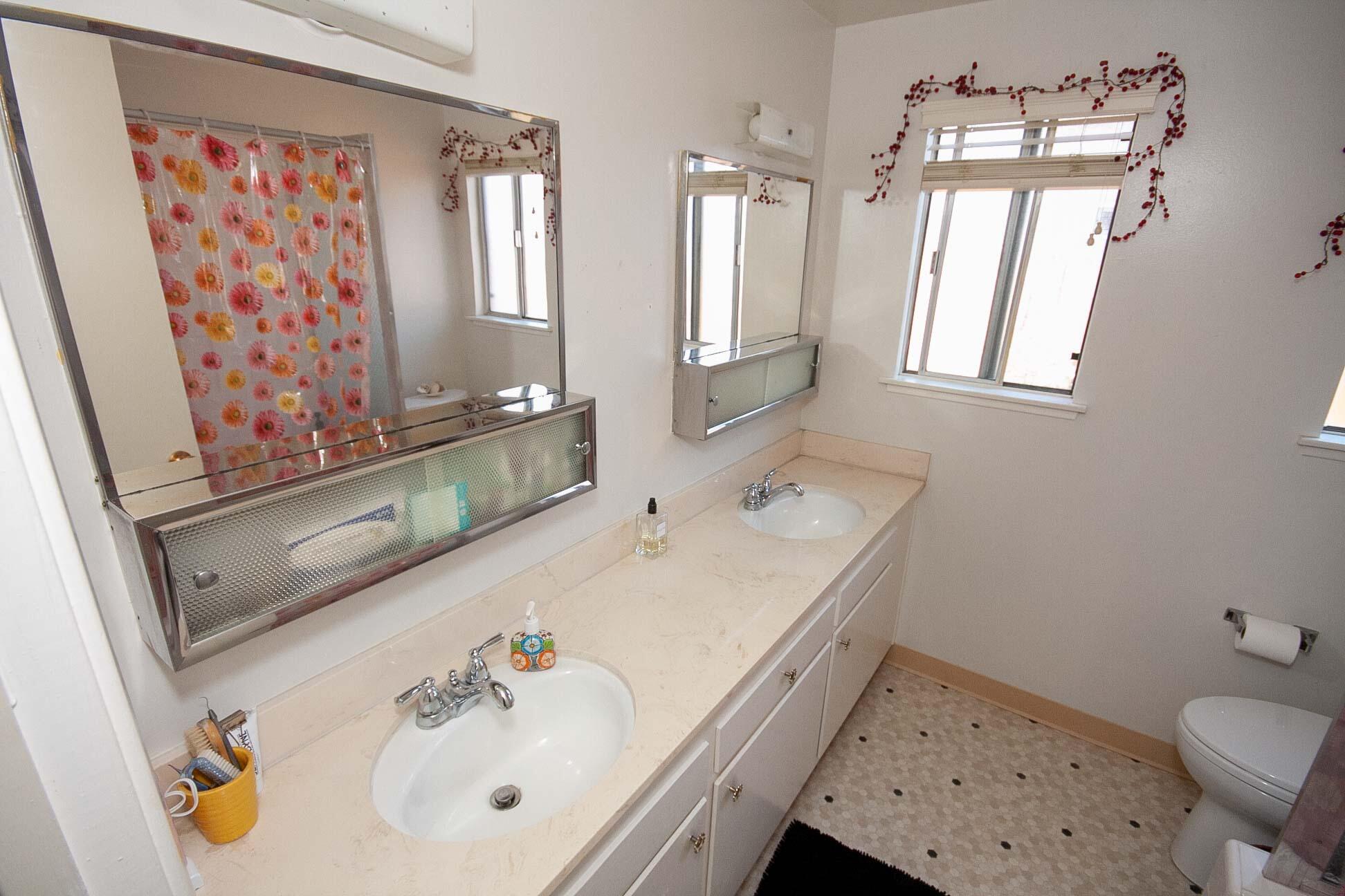 648 Dara Road Goleta, CA 93117 - Photo 7 of 14 a bathroom with a sink mirror and a toilet