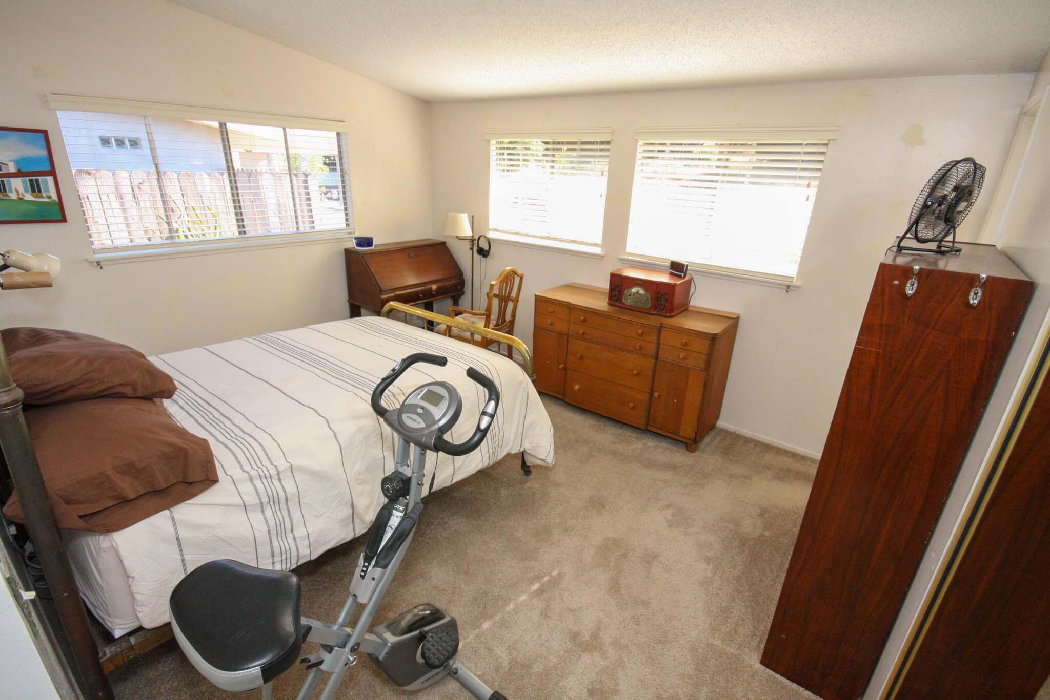 648 Dara Road Goleta, CA 93117 - Photo 8 of 14 a bed room with a bed and a chair