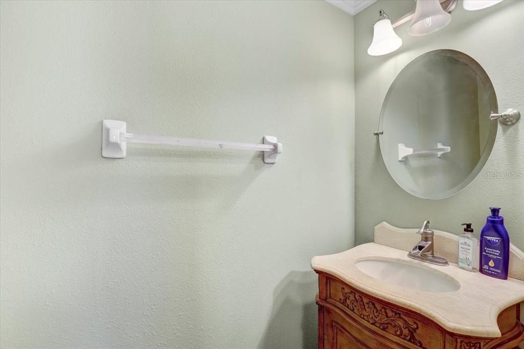 12657 Longcrest Drive Riverview, FL 33579 - Photo 14 of 55 a bathroom with a sink and a mirror