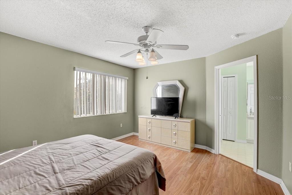 12657 Longcrest Drive Riverview, FL 33579 - Photo 16 of 55 a bedroom with a bed and a dresser