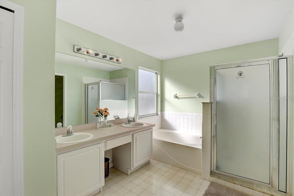 12657 Longcrest Drive Riverview, FL 33579 - Photo 20 of 55 a bathroom with a double vanity sink mirror and shower
