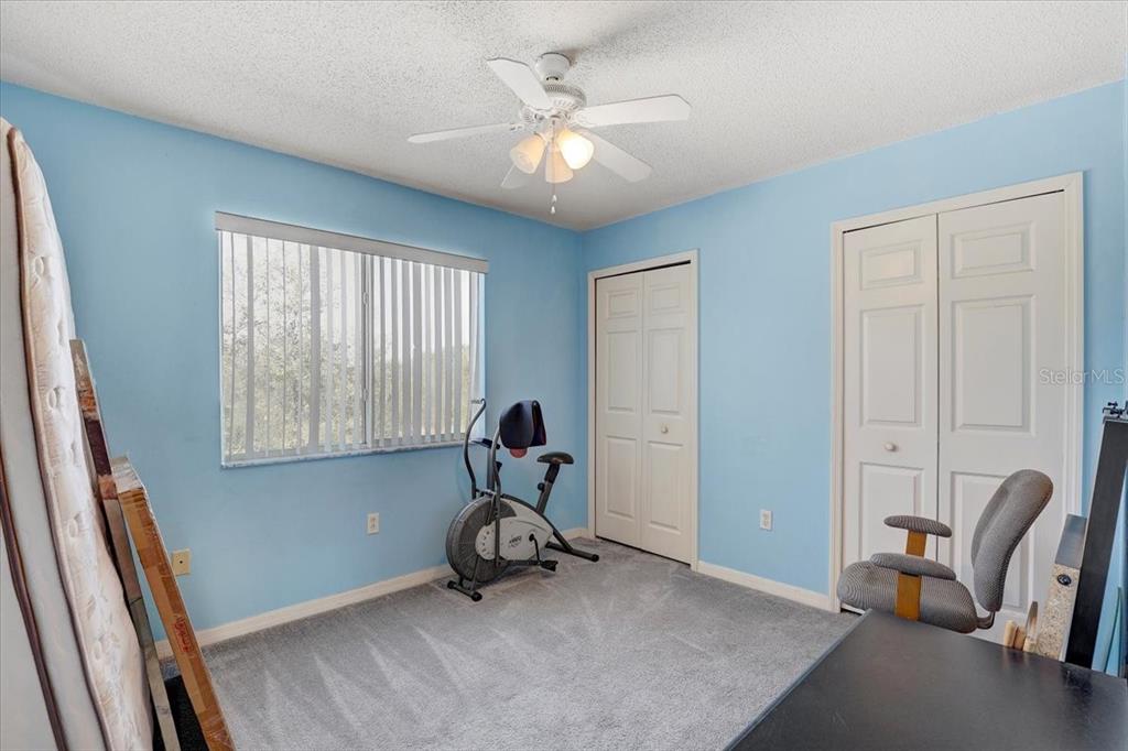 12657 Longcrest Drive Riverview, FL 33579 - Photo 28 of 55 a view of a workspace with furniture and a window