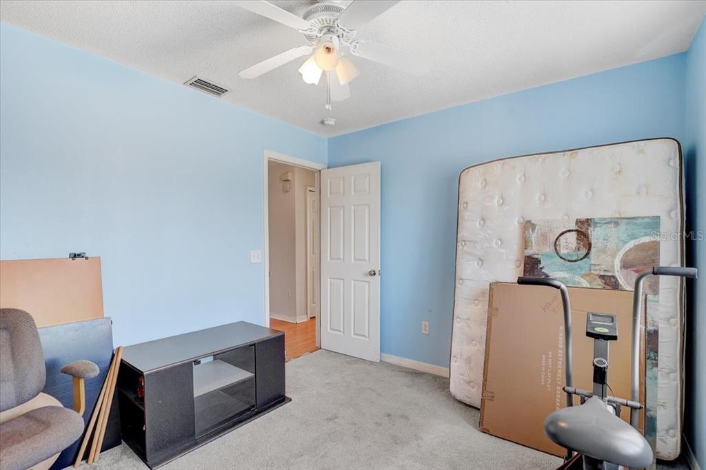 12657 Longcrest Drive Riverview, FL 33579 - Photo 29 of 55 a view of room with furniture and a chandelier