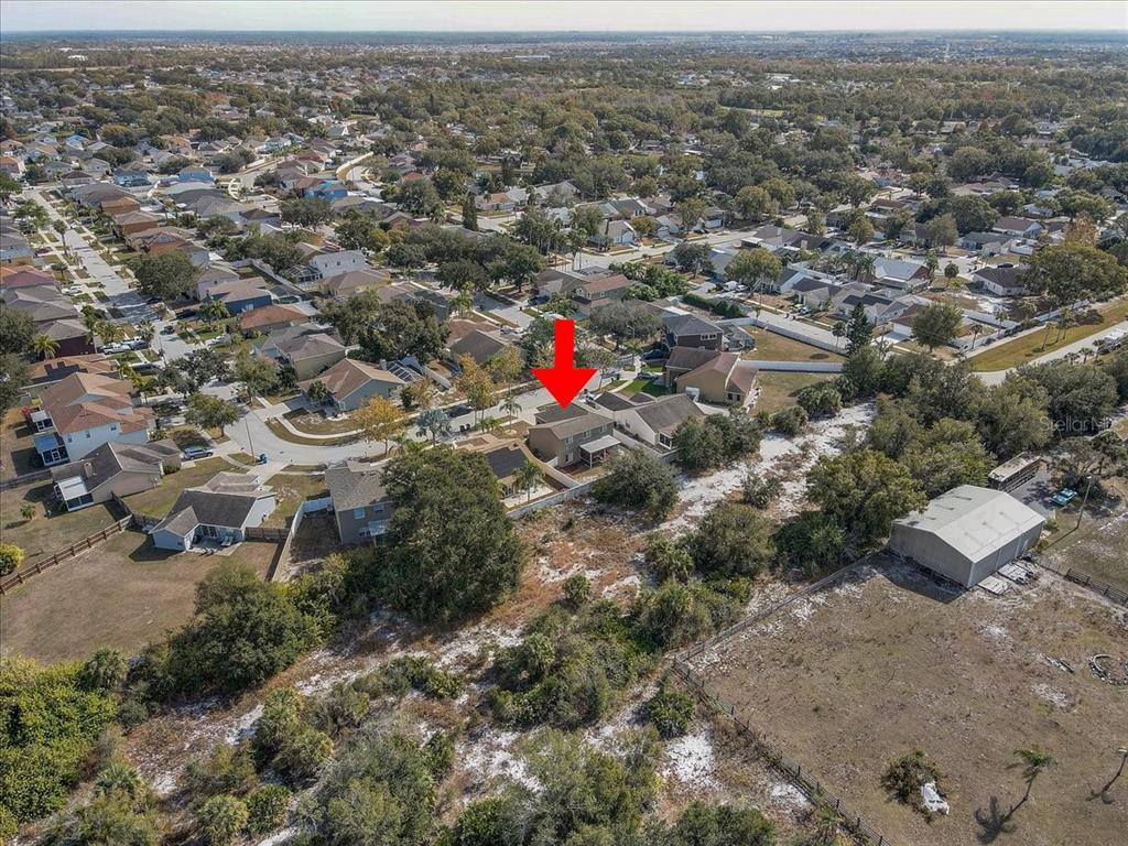 12657 Longcrest Drive Riverview, FL 33579 - Photo 42 of 55 an aerial view of residential houses with outdoor space and trees