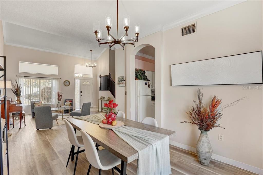 12657 Longcrest Drive Riverview, FL 33579 - Photo 9 of 55 a view of a dining room with furniture and chandelier