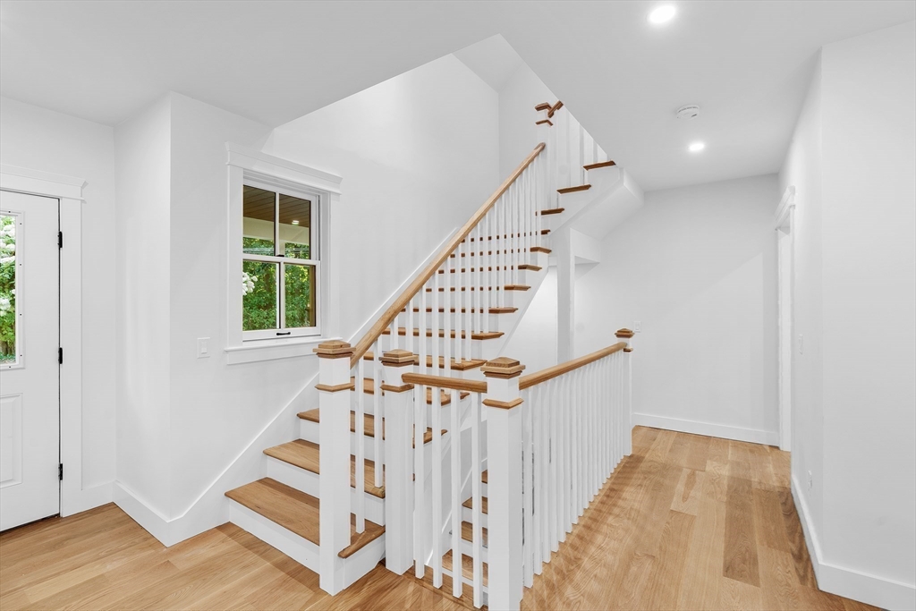 83 Eliot Street Natick, MA 01760 - Photo 14 of 30 a view of entryway with wooden floor