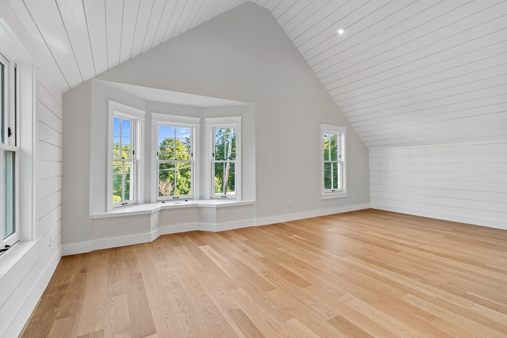 83 Eliot Street Natick, MA 01760 - Photo 17 of 30 an empty room with wooden floor and windows