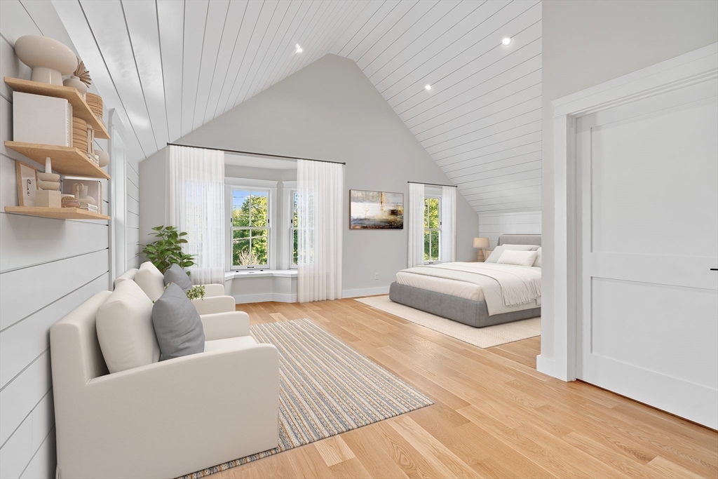83 Eliot Street Natick, MA 01760 - Photo 18 of 30 a bedroom with a large bed and a couch