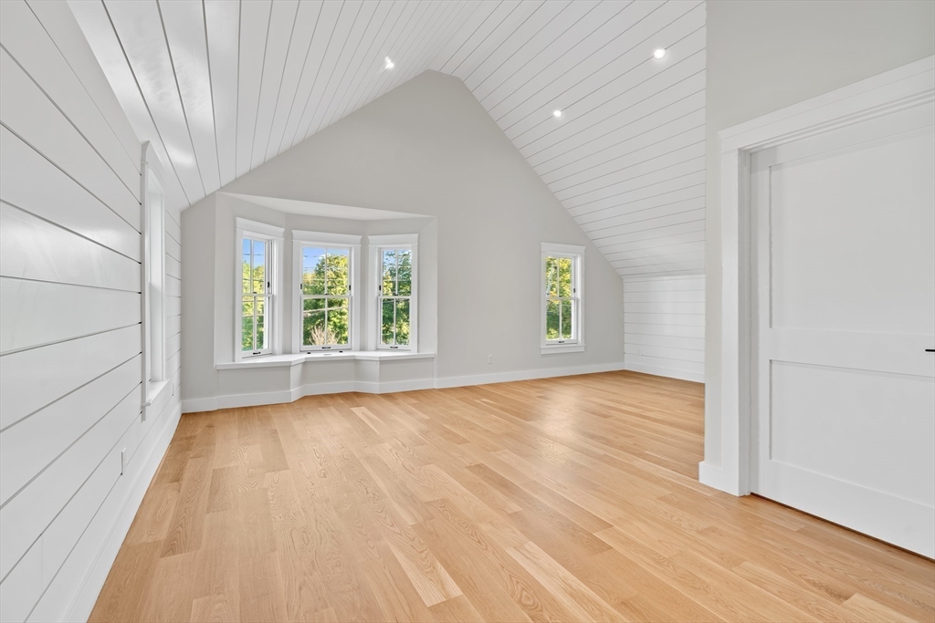 83 Eliot Street Natick, MA 01760 - Photo 19 of 30 wooden floor in an empty room with a window