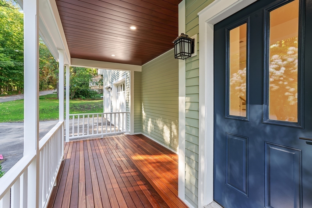 83 Eliot Street Natick, MA 01760 - Photo 2 of 30 a view of porch with wooden floor and outdoor space