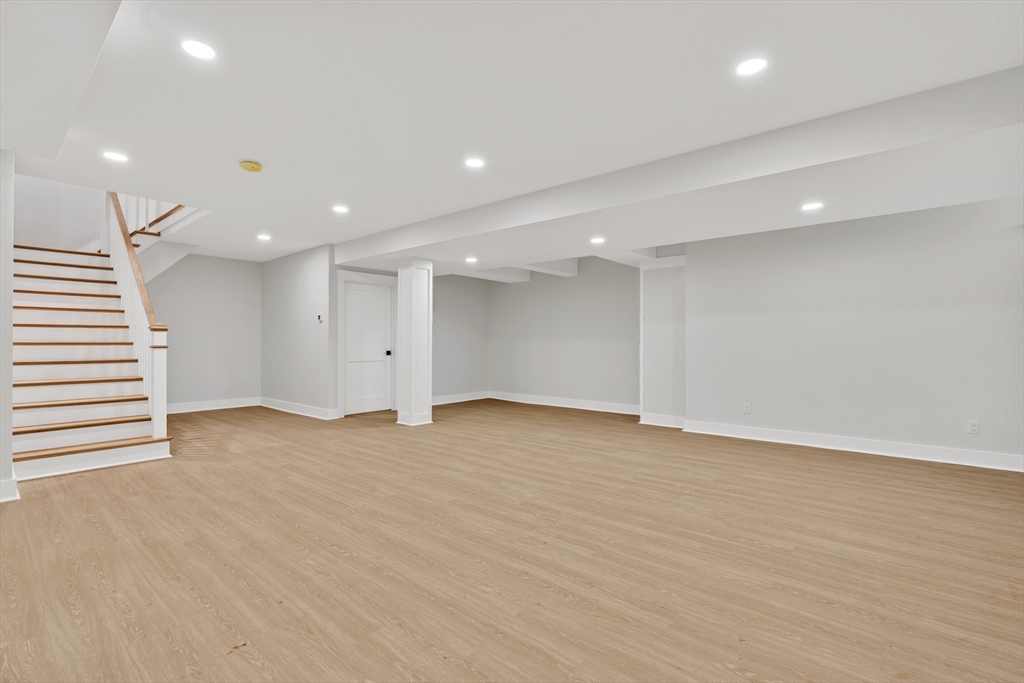 83 Eliot Street Natick, MA 01760 - Photo 28 of 30 a view of an empty room with wooden floor