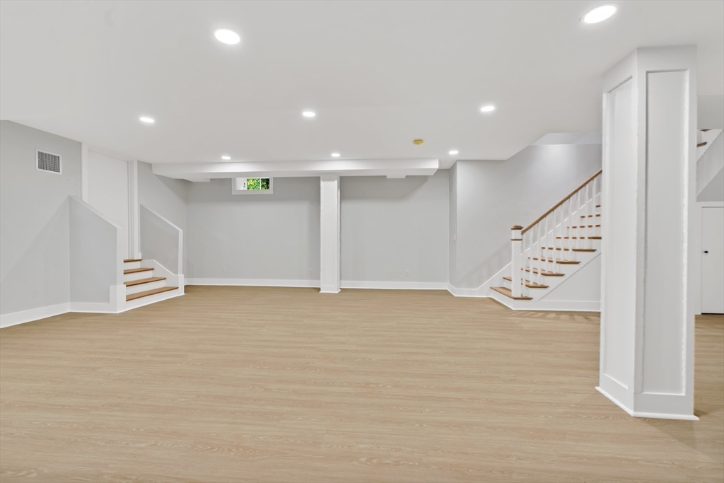 83 Eliot Street Natick, MA 01760 - Photo 29 of 30 a view of an empty room with wooden floor