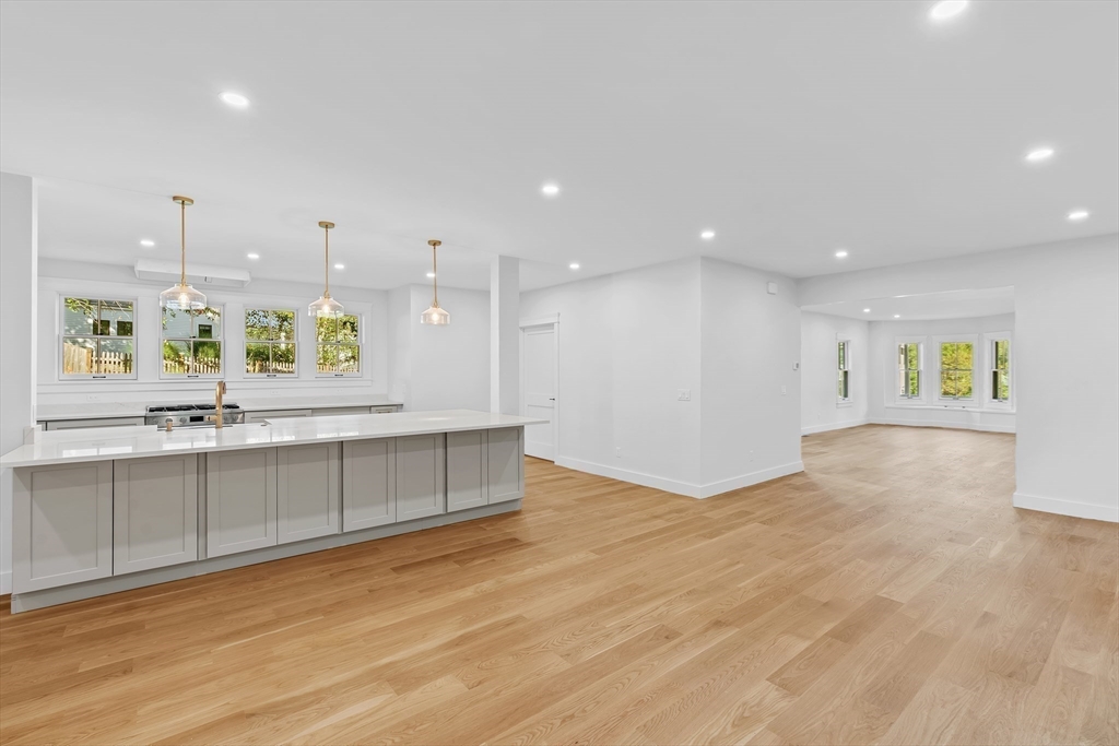 83 Eliot Street Natick, MA 01760 - Photo 8 of 30 a large white kitchen with a large window