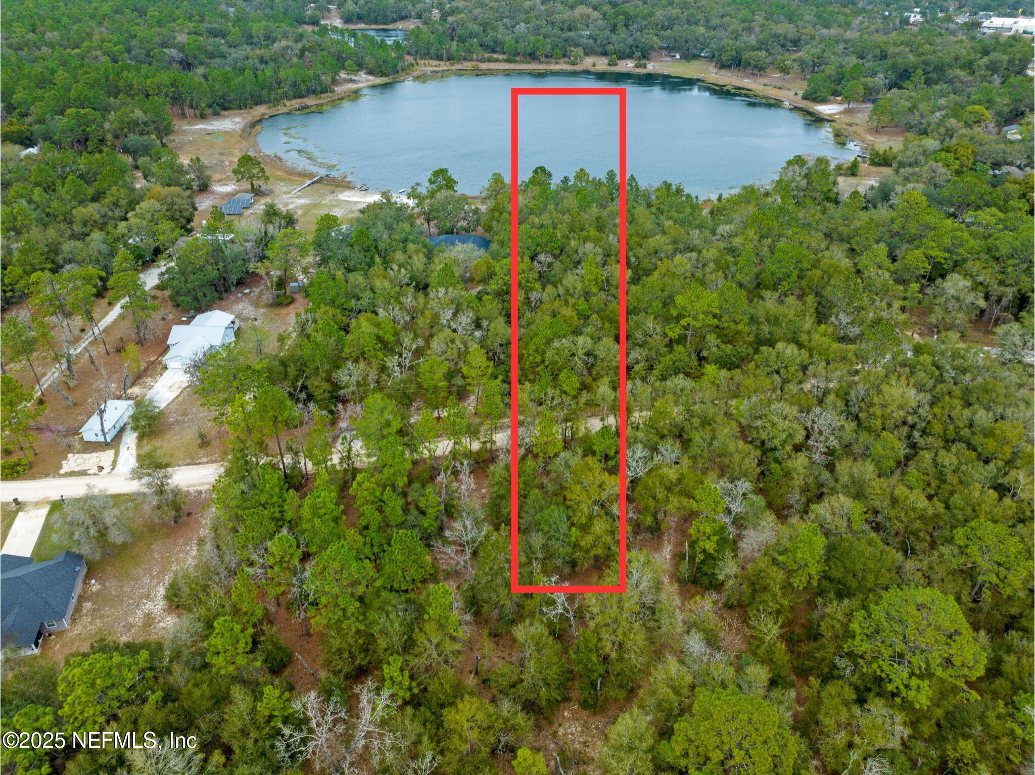 0 Southeast 46th Loop Keystone Heights, FL 32656 - Photo 3 of 7 an aerial view of residential house with outdoor space and trees around