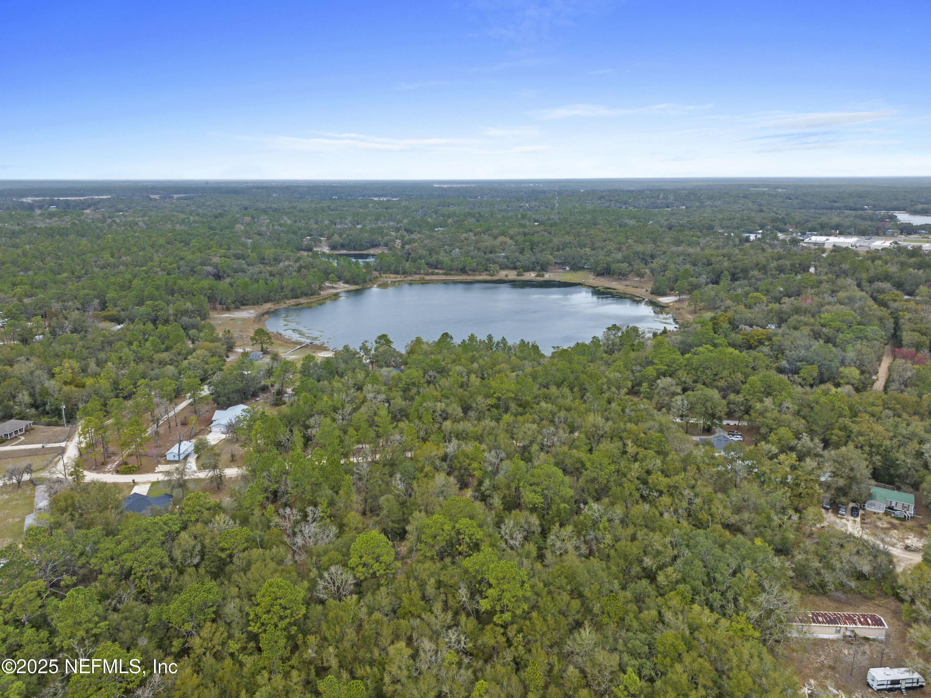 0 Southeast 46th Loop Keystone Heights, FL 32656 - Photo 7 of 7 a view of a lake with a yard