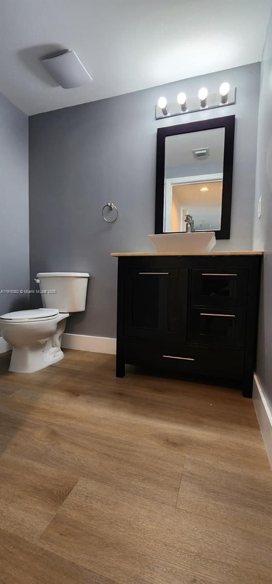 1250 South Miami Avenue, Unit 1911 Miami, FL 33130 - Photo 13 of 23 a living room with a mirror and a wooden floor