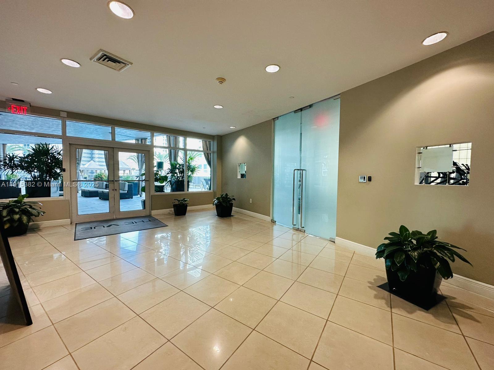 1250 South Miami Avenue, Unit 1911 Miami, FL 33130 - Photo 18 of 23 a lobby with a couch and a chandelier