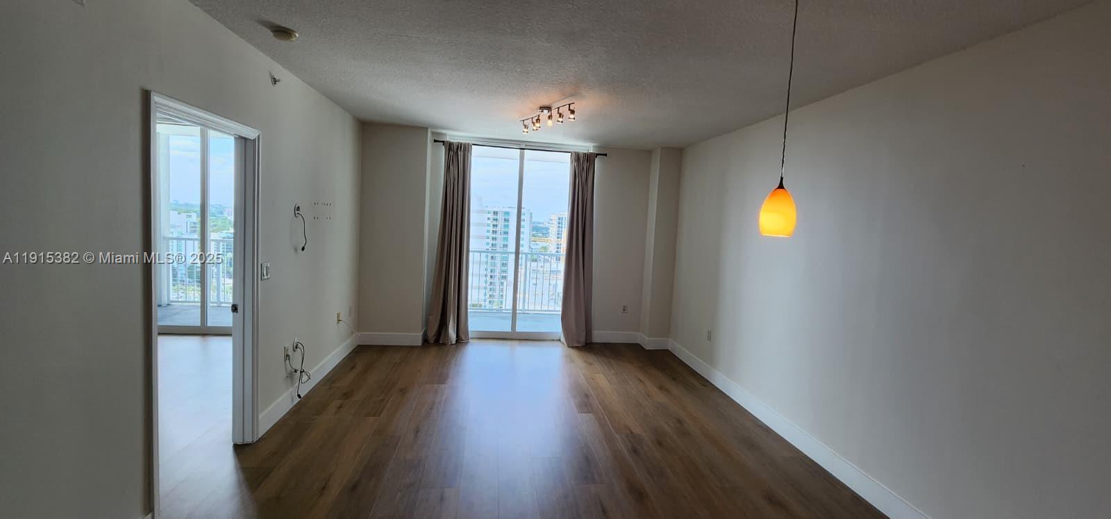 1250 South Miami Avenue, Unit 1911 Miami, FL 33130 - Photo 5 of 23 a view of a hallway with wooden floor