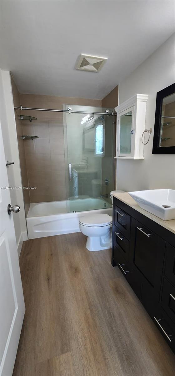 1250 South Miami Avenue, Unit 1911 Miami, FL 33130 - Photo 10 of 23 a bathroom with a double vanity sink toilet and shower