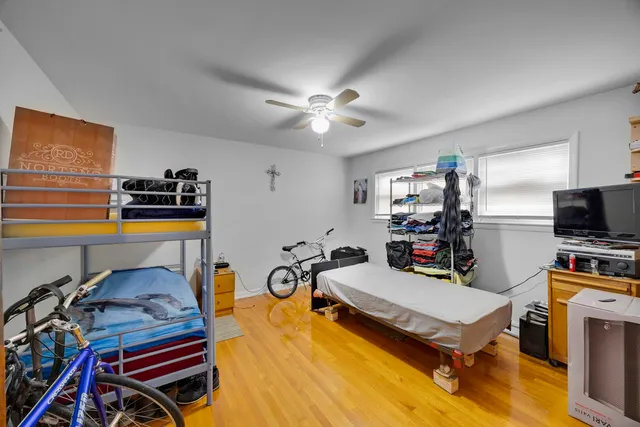 a bedroom with furniture and a flat screen tv