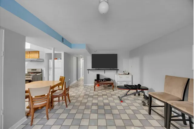 a kitchen with wooden cabinets and a stove top oven