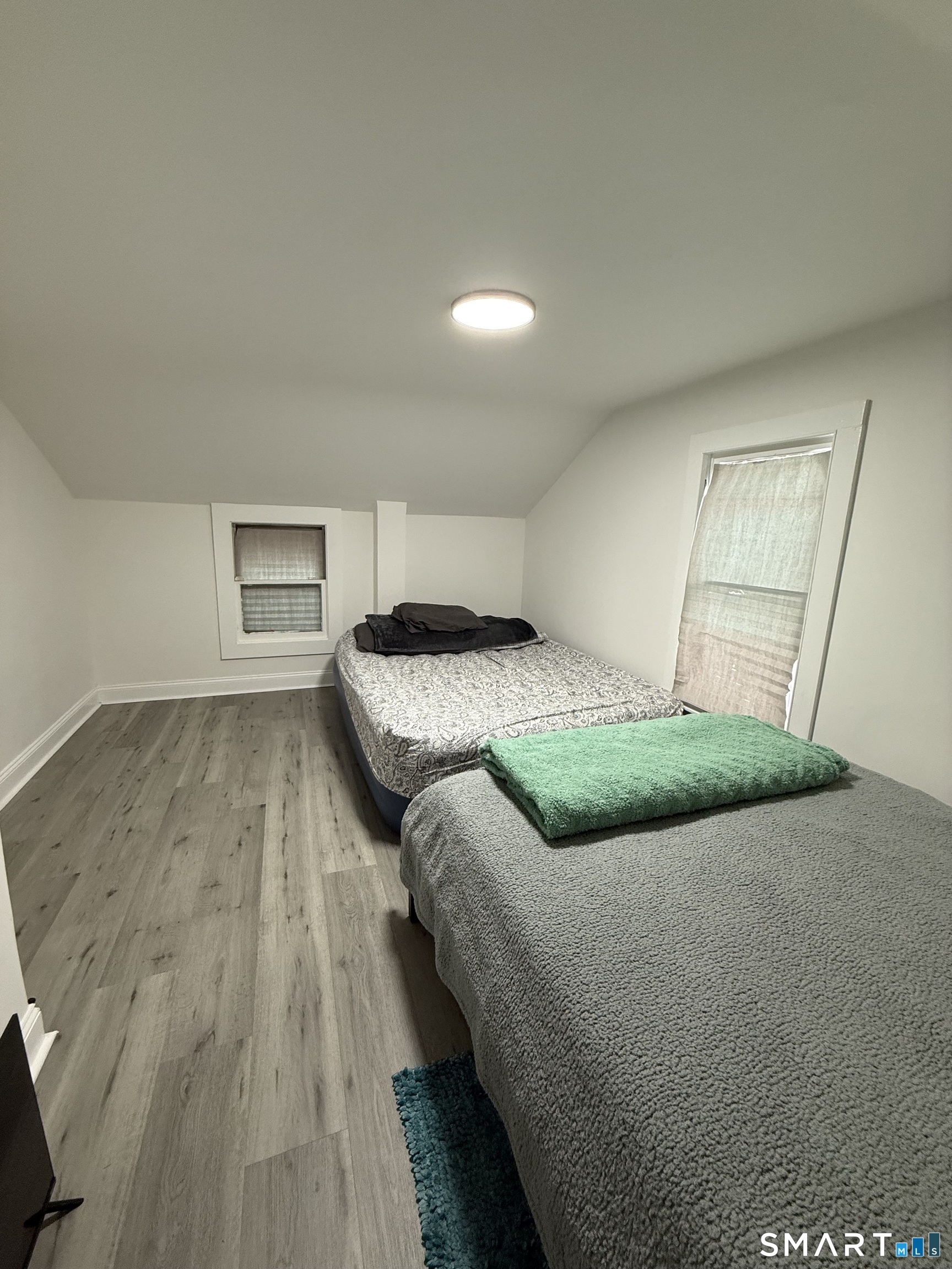 5 Winthrop Street Torrington, CT 06790 - Photo 13 of 18 a bedroom with a bed and a night stand