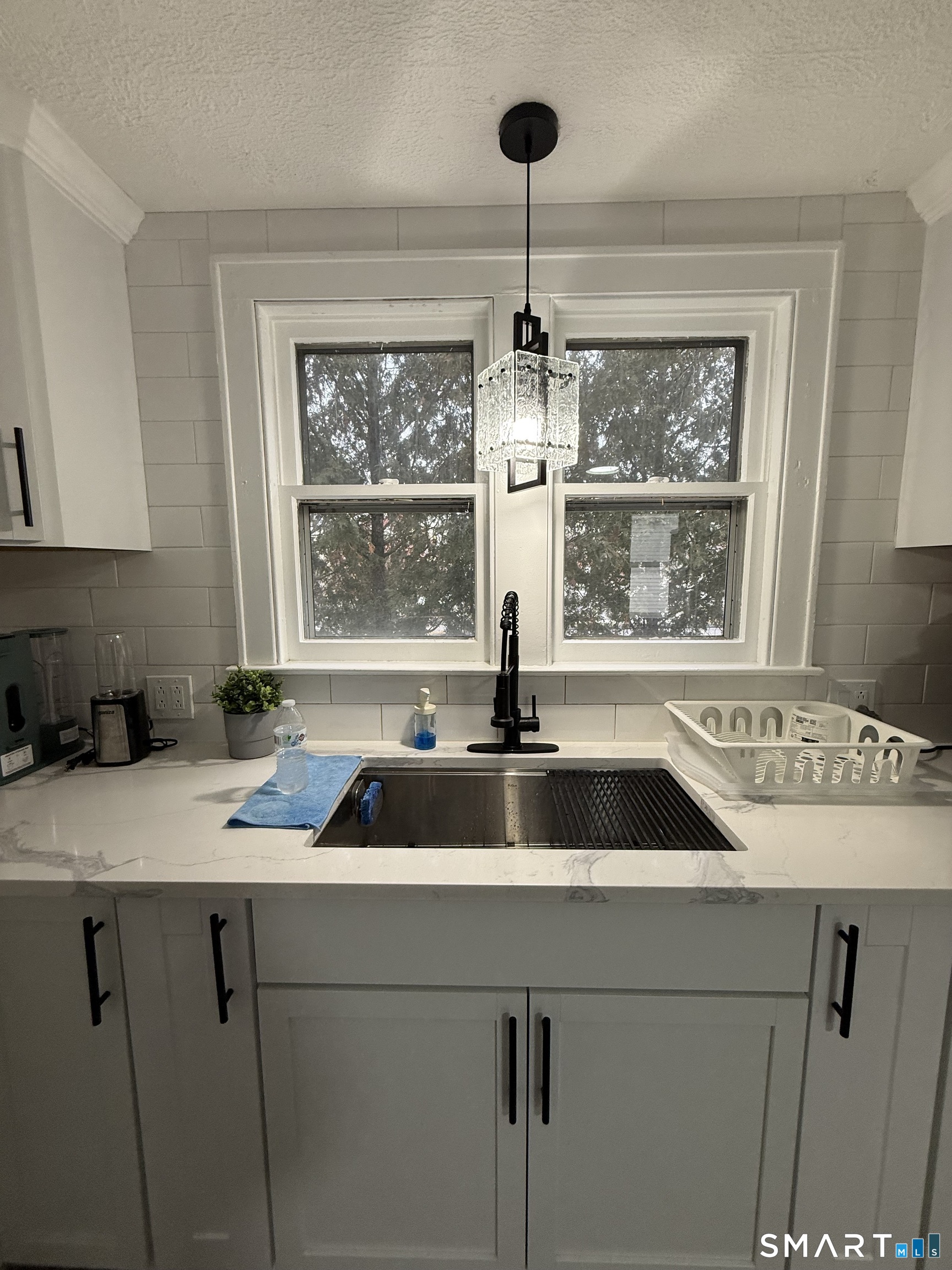 5 Winthrop Street Torrington, CT 06790 - Photo 16 of 18 a kitchen with a sink and a window