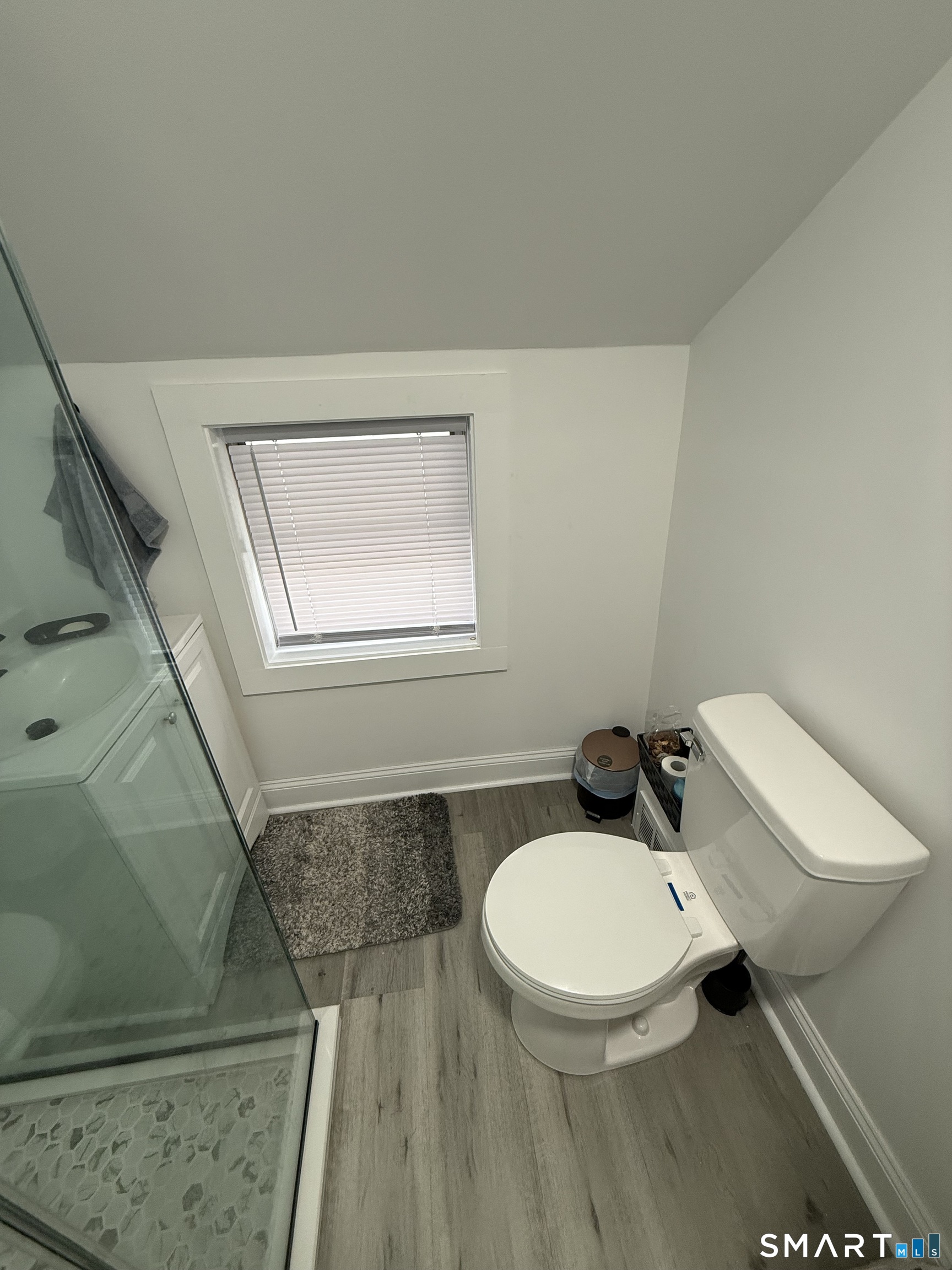 5 Winthrop Street Torrington, CT 06790 - Photo 6 of 18 a bathroom with a toilet a sink and mirror