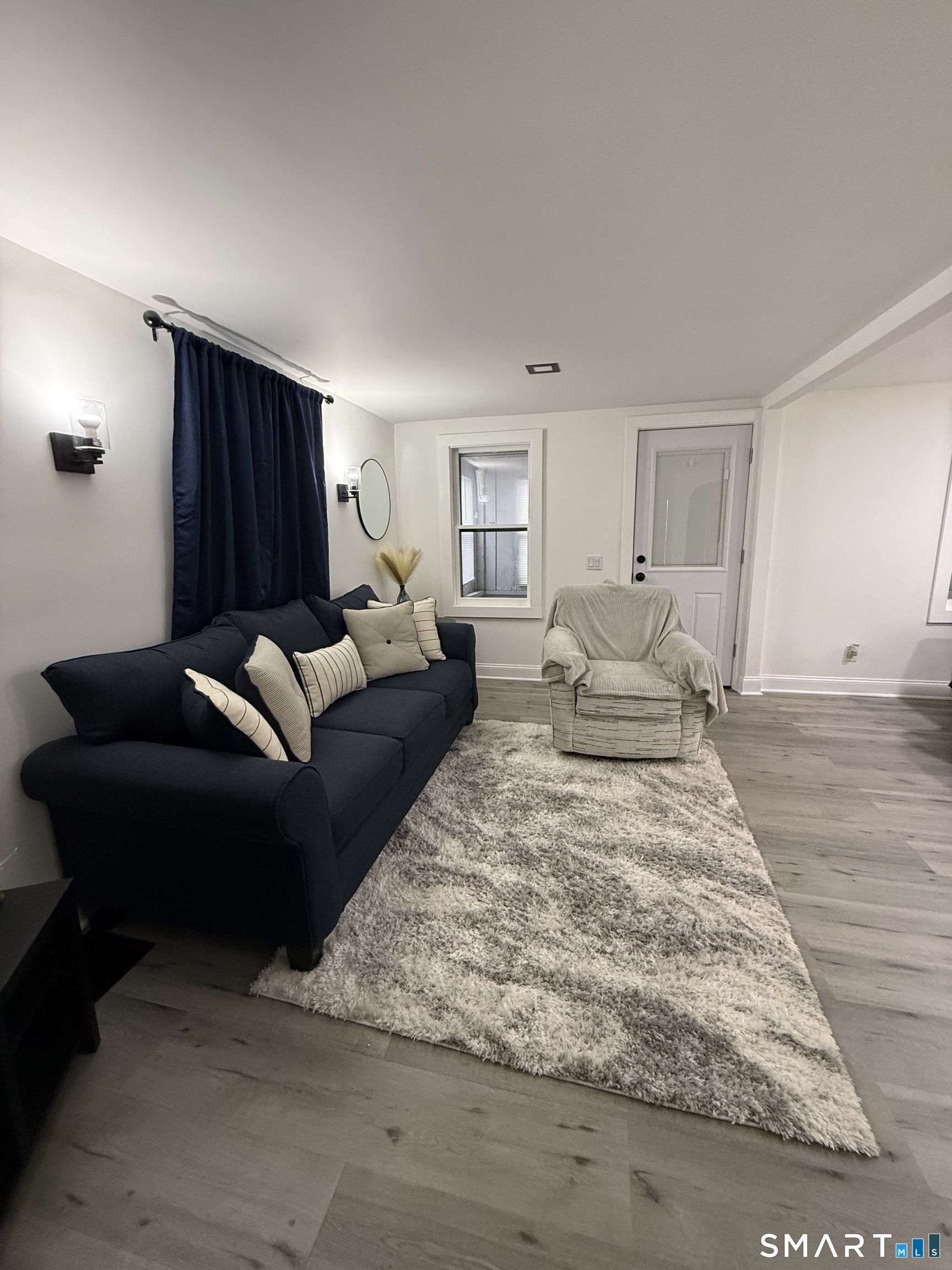 5 Winthrop Street Torrington, CT 06790 - Photo 7 of 18 a living room with furniture window and a wooden floor