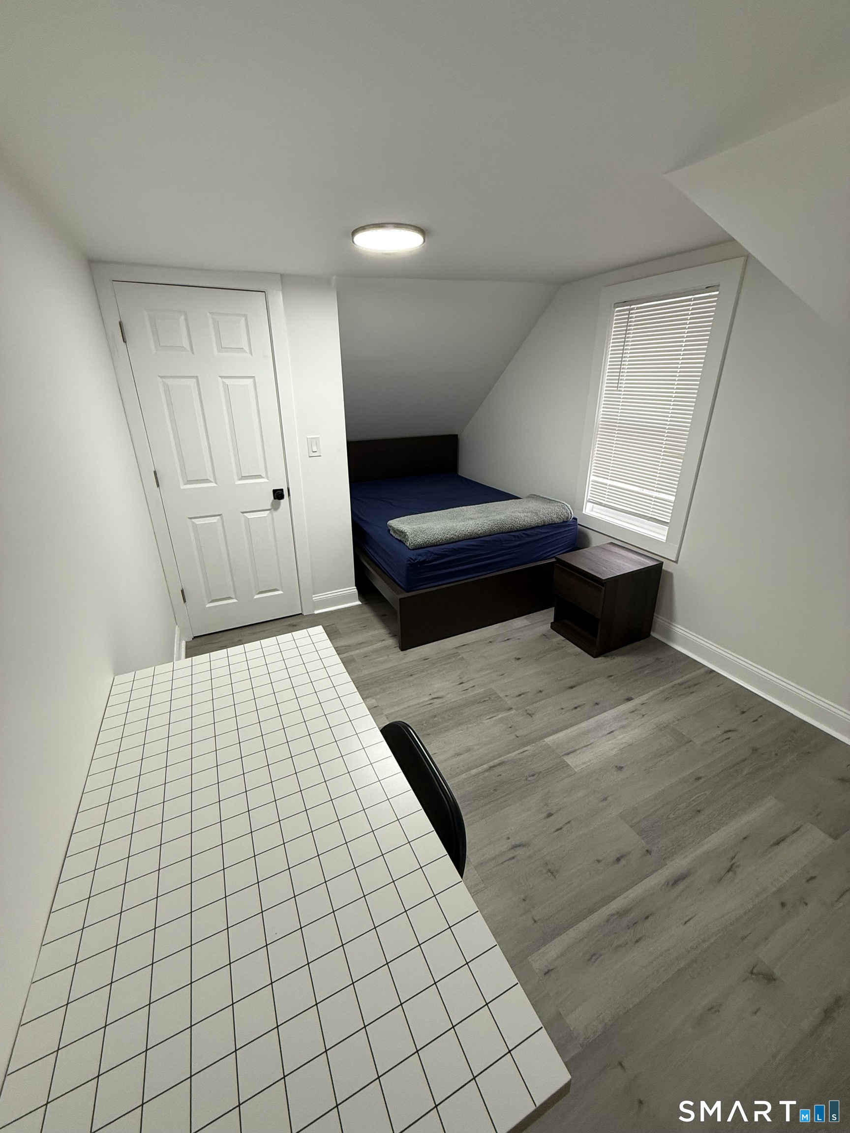5 Winthrop Street Torrington, CT 06790 - Photo 8 of 18 a bedroom with a bed and a night stand