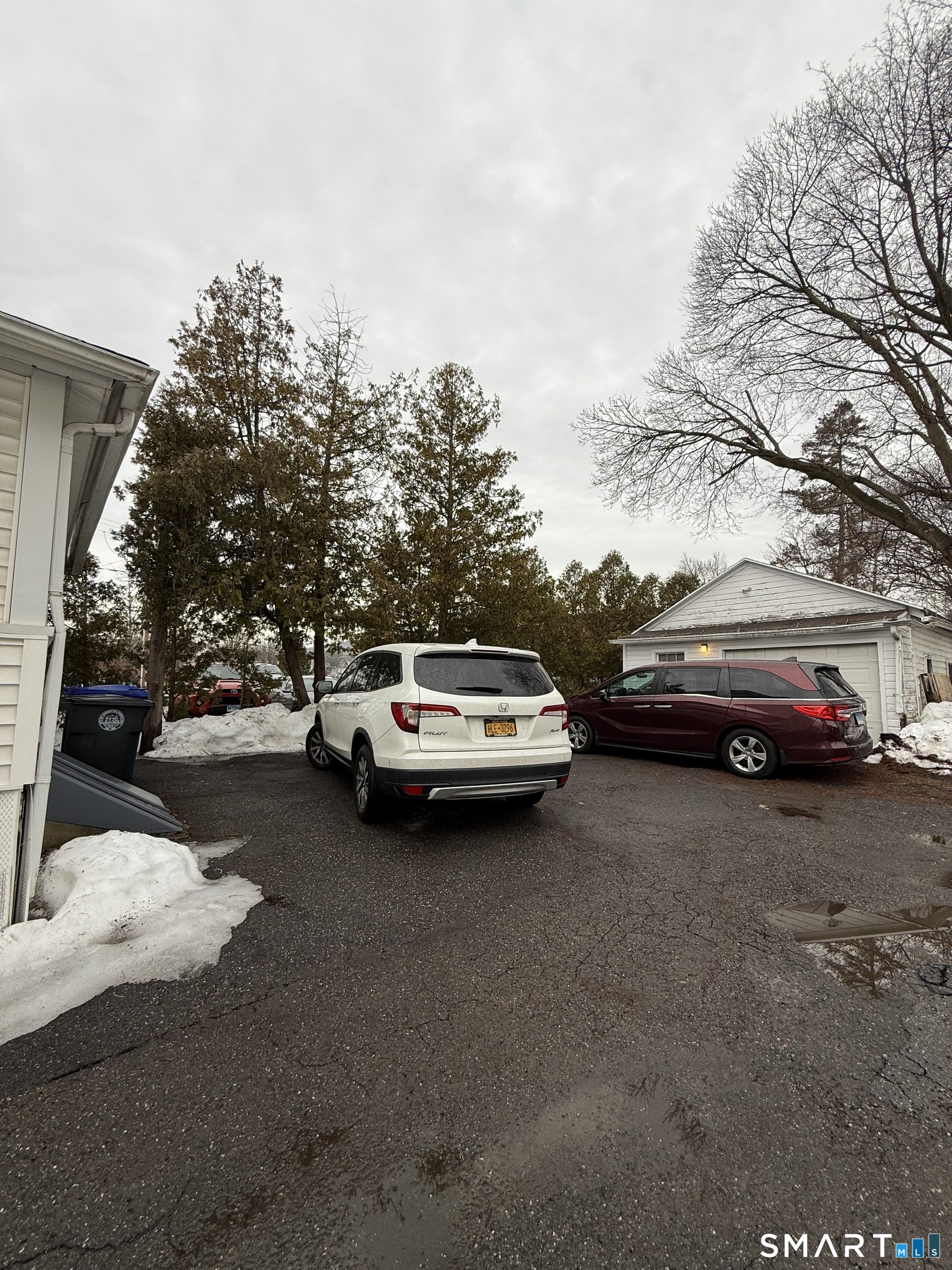 5 Winthrop Street Torrington, CT 06790 - Photo 8 of 18 a car parked on the side of the road