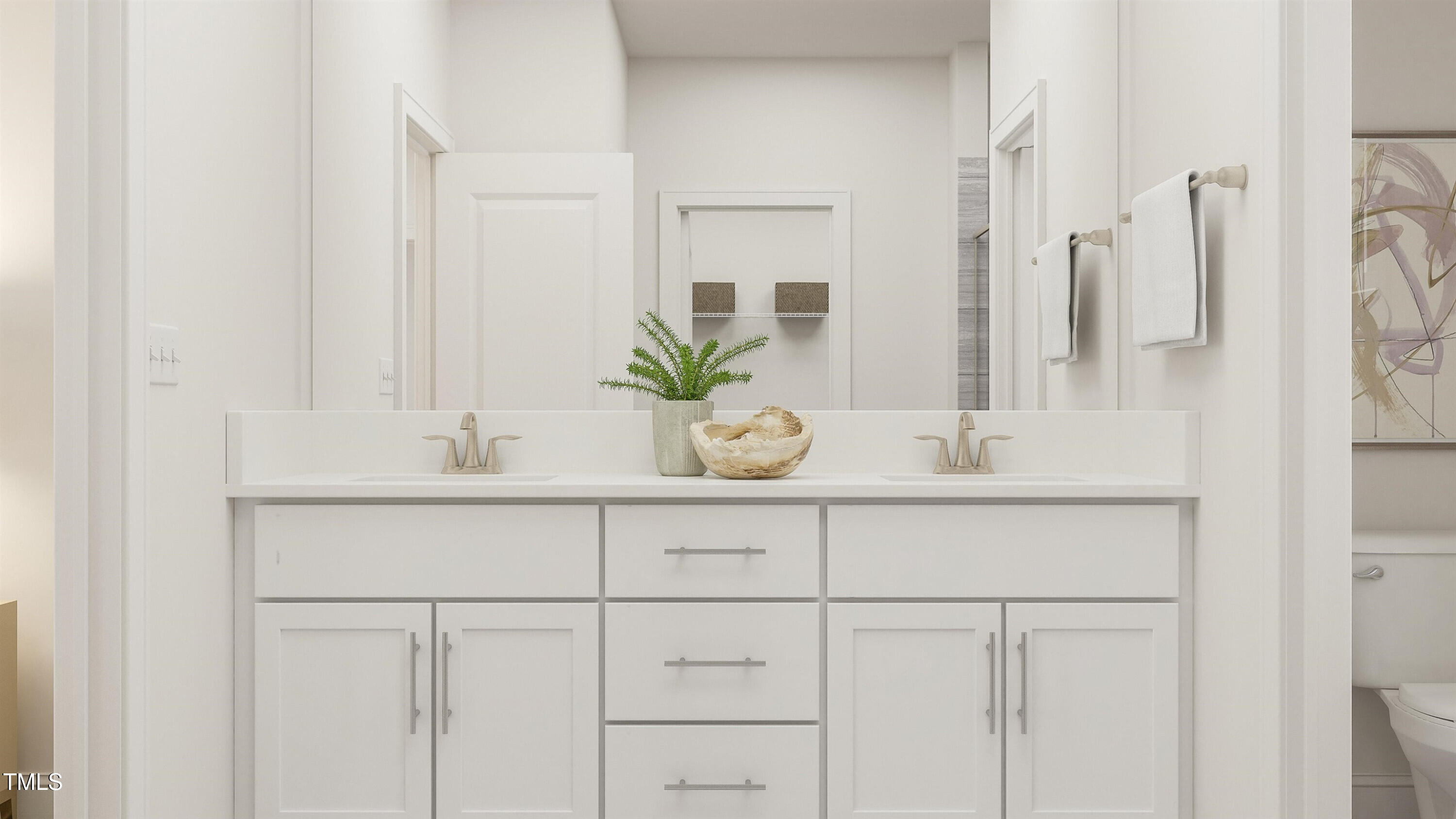 336 Calvander Lane Apex, NC 27539 - Photo 22 of 38 a bathroom with cabinets a sink and a mirror