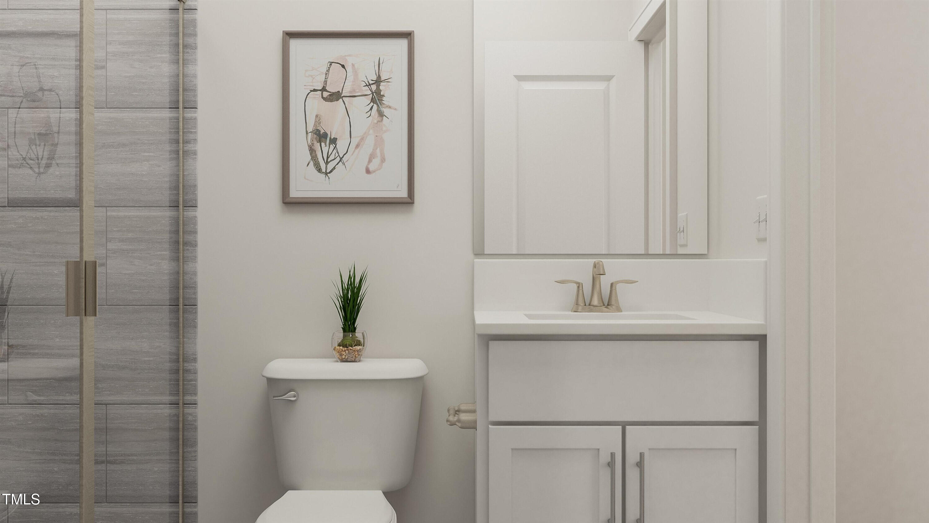 336 Calvander Lane Apex, NC 27539 - Photo 4 of 38 a bathroom with a sink a toilet and a mirror