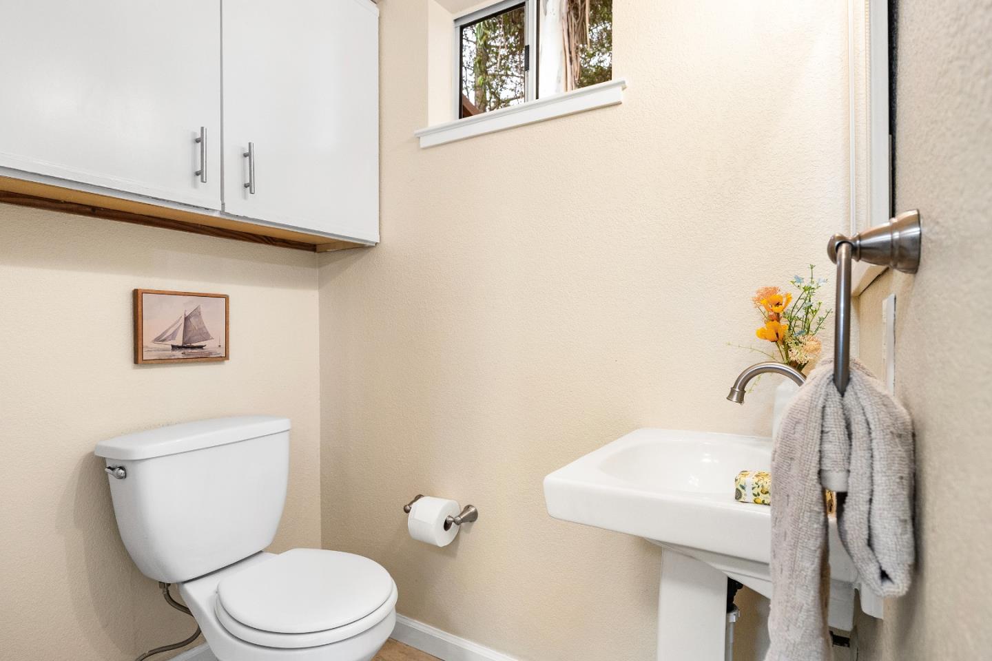 1644 Ocean Street Santa Cruz, CA 95060 - Photo 24 of 60 a bathroom with a toilet a sink and mirror
