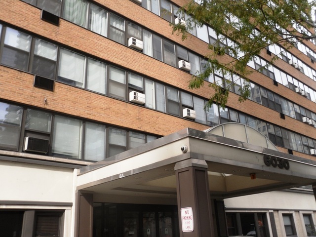 6030 North Sheridan Road, Unit 1402 Chicago, IL 60660 - Photo 1 of 1 a view of a building with a large windows
