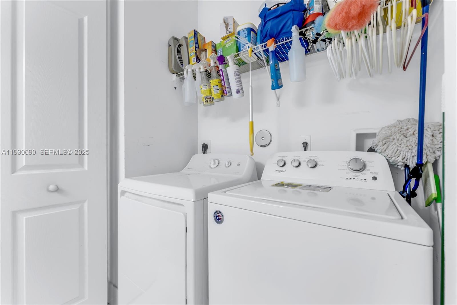 3600 Oaks Clubhouse Drive, Unit 103 Pompano Beach, FL 33069 - Photo 16 of 16 a utility room with dryer and washer