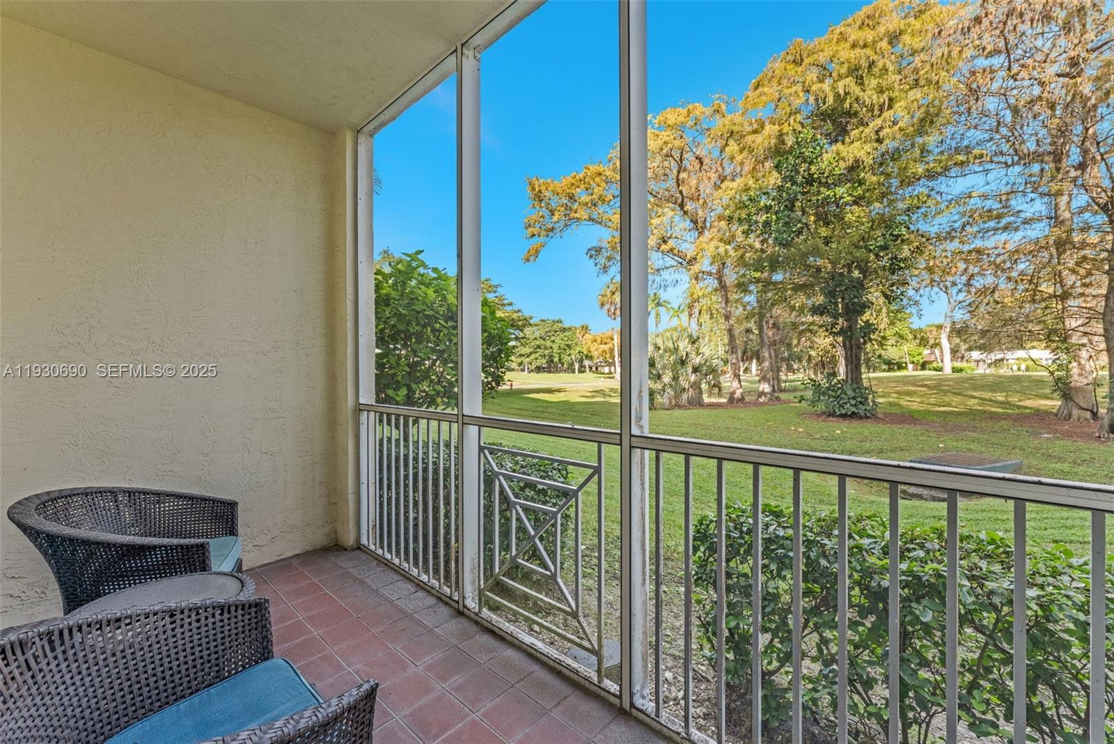3600 Oaks Clubhouse Drive, Unit 103 Pompano Beach, FL 33069 - Photo 3 of 16 a view of a balcony with furniture