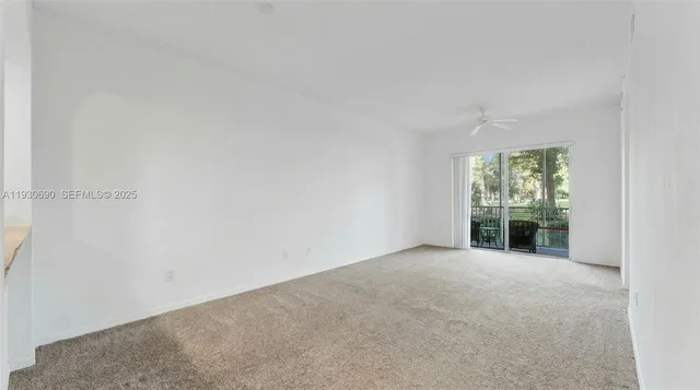 a living room with furniture and a painting on the wall