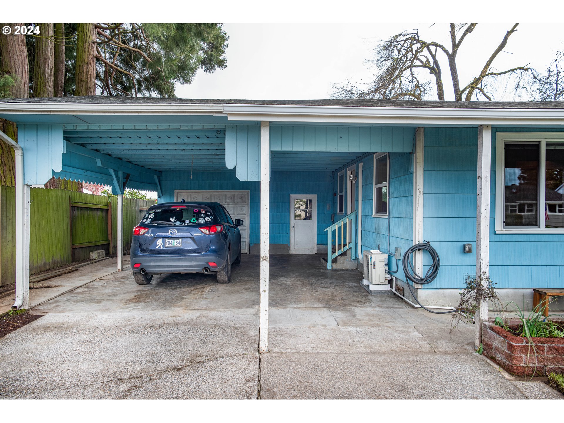 1159 M Street Springfield, OR 97477 - Photo 7 of 16 a car parked in front of house