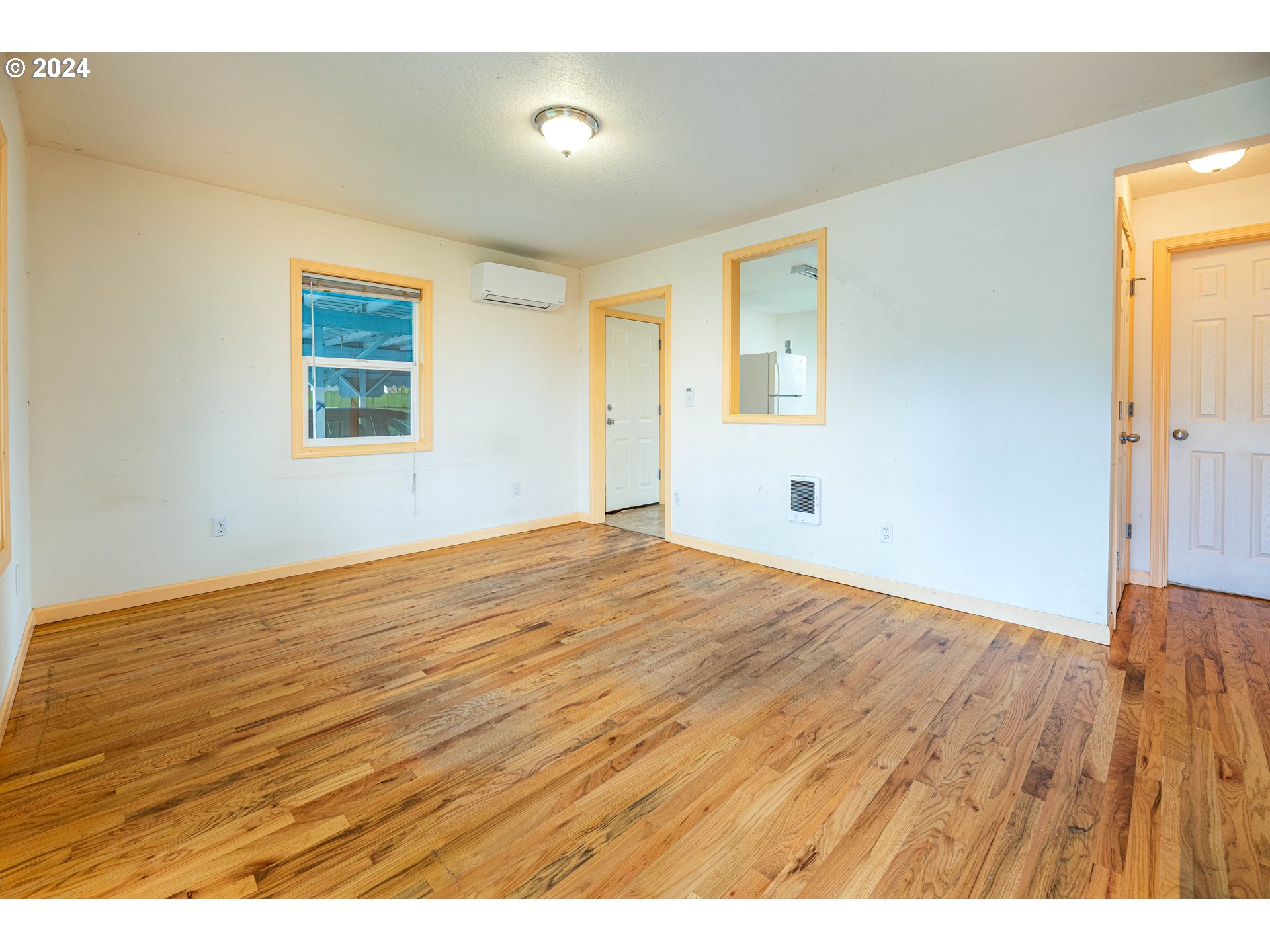 1159 M Street Springfield, OR 97477 - Photo 8 of 16 a view of empty room with wooden floor