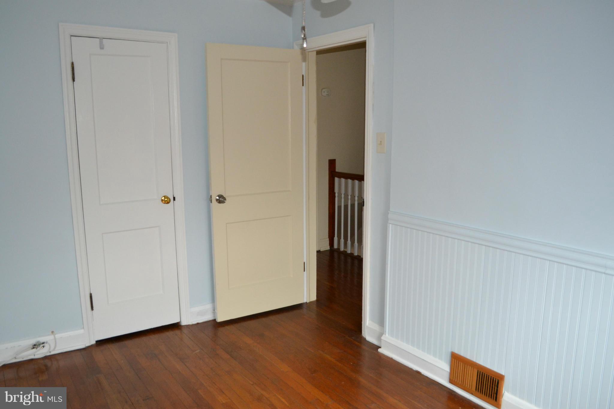 203 Grove Park Road Baltimore, MD 21225 - Photo 11 of 23 a view of an empty room and wooden floor