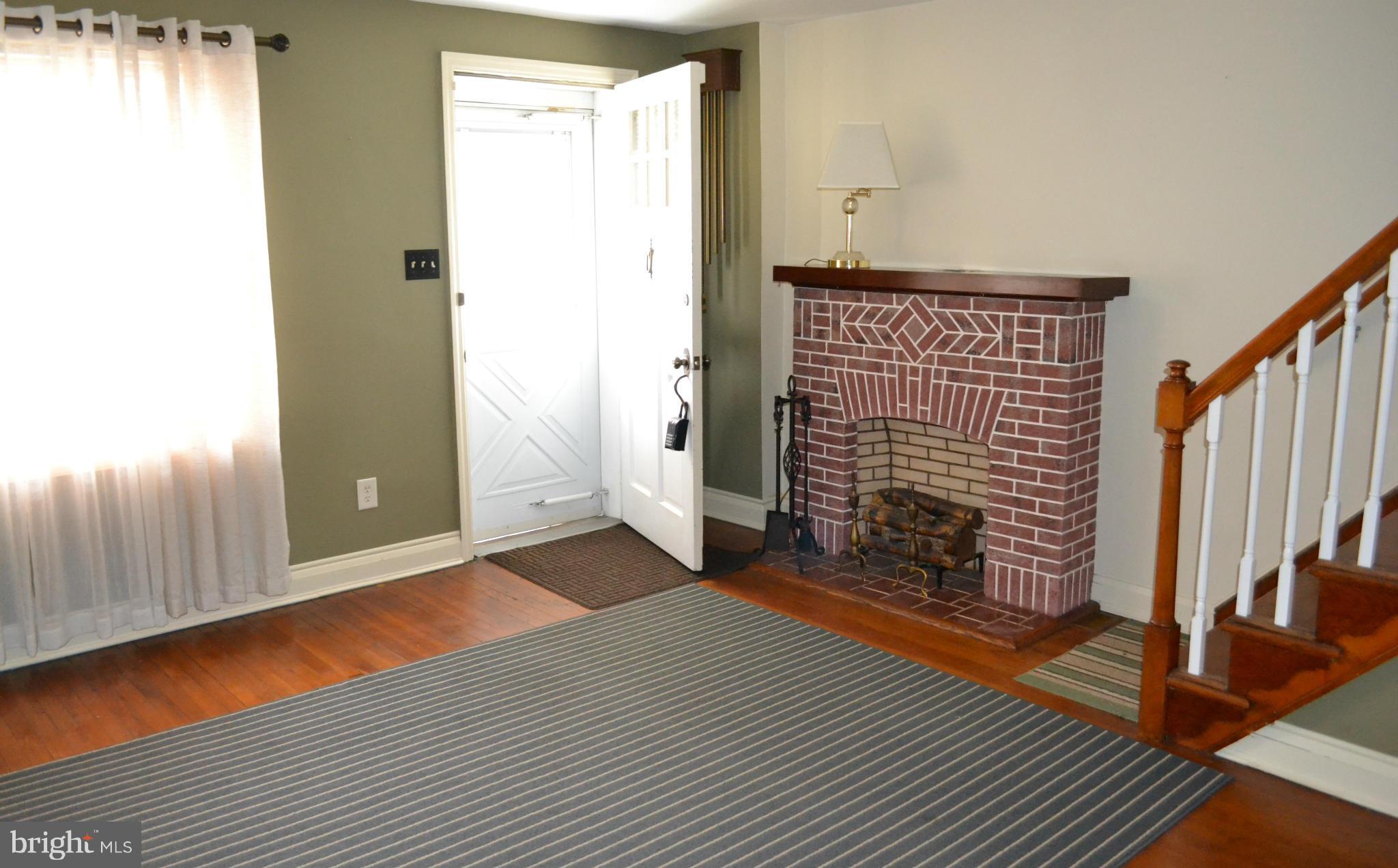 203 Grove Park Road Baltimore, MD 21225 - Photo 3 of 23 a view of empty room with wooden floor