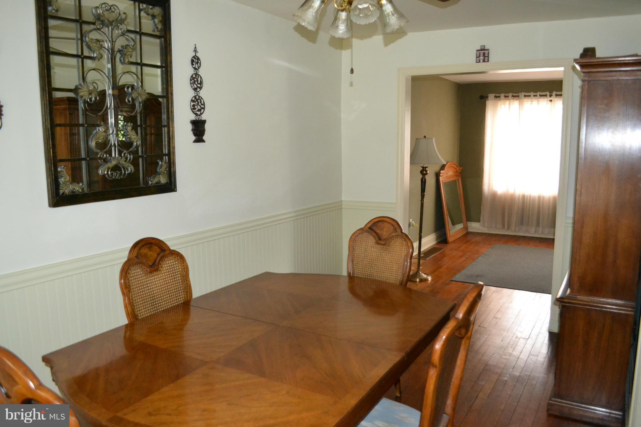 203 Grove Park Road Baltimore, MD 21225 - Photo 8 of 23 a room with a table and chairs