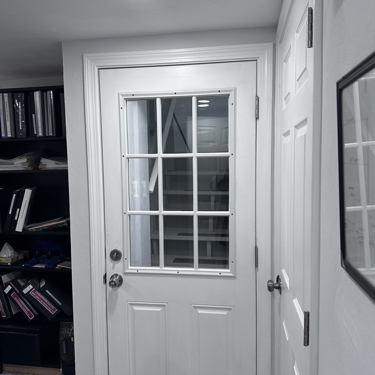 1163 Whipple Road Tewksbury, MA 01876 - Photo 15 of 31 a view of a door and a window