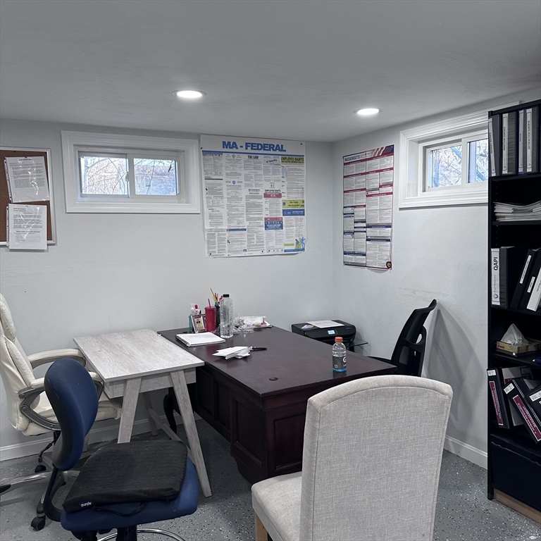 1163 Whipple Road Tewksbury, MA 01876 - Photo 16 of 31 a view of a workspace with furniture and a window
